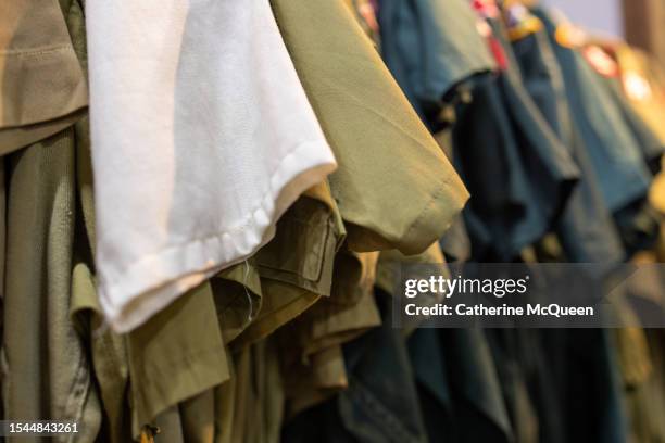 vintage scouting shirts at antique flea market - boy scouts of america stock pictures, royalty-free photos & images