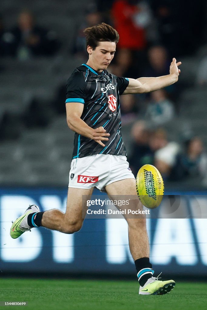 Diss Rozee Connor Rozee of the Power warms up before the round 18 AFL match ...