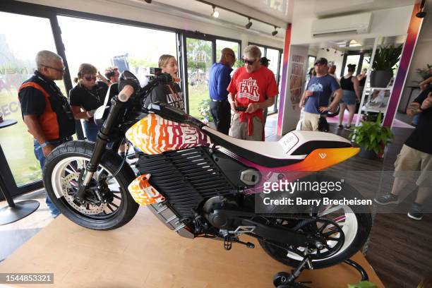 Festival goers check out Harley-Davidson and Livewire JUMPSTART during the Harley-Davidson's Homecoming Festival - Day 1 at Veterans Park on July 14,...