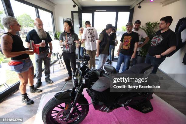 Festival goers check out Harley-Davidson and Livewire JUMPSTART during the Harley-Davidson's Homecoming Festival - Day 1 at Veterans Park on July 14,...