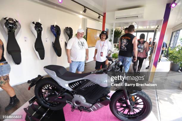 Festival goers check out Harley-Davidson and Livewire JUMPSTART during the Harley-Davidson's Homecoming Festival - Day 1 at Veterans Park on July 14,...