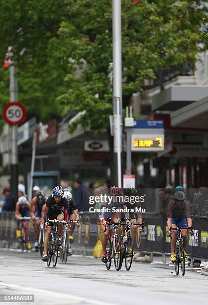 Javier Gomez of Spain, Jonathan Browlee of Great Britain and Bevan Docherty of New Zealand ride down Queen Street during the 2012 ITU World triathlon...