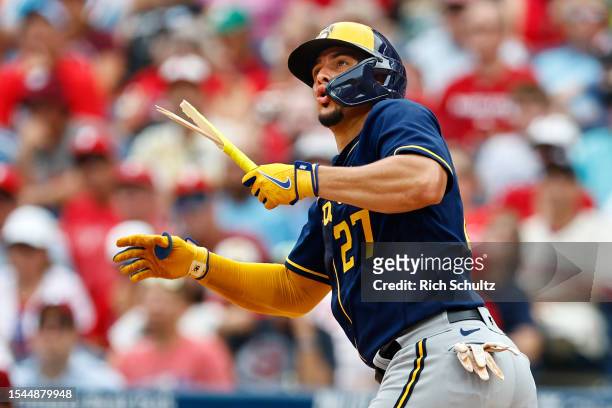 Willy Adames of the Milwaukee Brewers breaks his bat on a pop up against the Philadelphia Phillies during the sixth inning of a game at Citizens Bank...