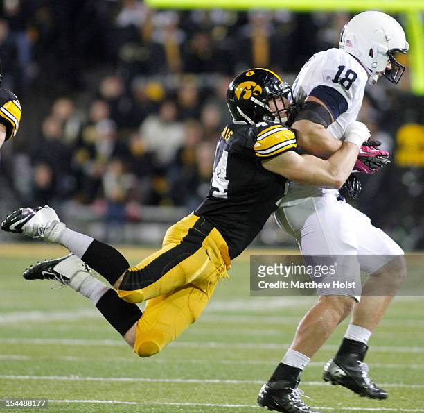 Tight end Jesse James of the Penn State Nittany Lions rushes up field during the second quarter in front of linebacker James Morris of the Iowa...