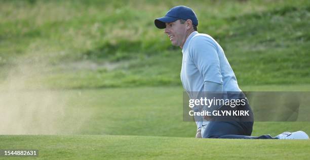 Northern Ireland's Rory McIlroy plays out of a bunker onto the 18th green on day one of the 151st British Open Golf Championship at Royal Liverpool...