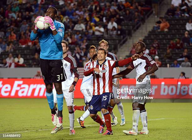 Steward Ceus of the Colorado Rapids steps in front of Alejandro Moreno of Chivas USA and teammate Hendry Thomas to block a corner kick during the...