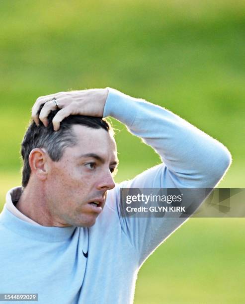Northern Ireland's Rory McIlroy reacts after putting on the 18th green on day one of the 151st British Open Golf Championship at Royal Liverpool Golf...