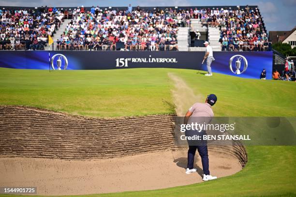South Korea's Byeong Hun An plays out of a bunker onto the 17th green on day one of the 151st British Open Golf Championship at Royal Liverpool Golf...