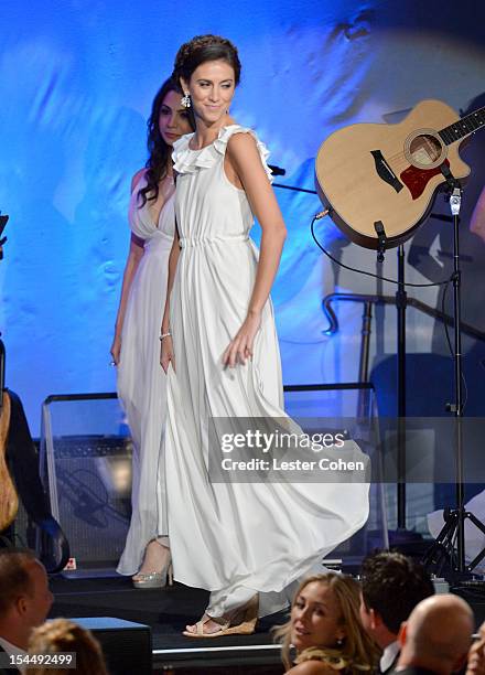 Models walk onstage during the 26th Anniversary Carousel Of Hope Ball presented by Mercedes-Benz at The Beverly Hilton Hotel on October 20, 2012 in...