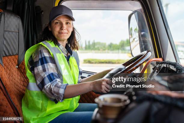 female truck driver - trucker hat stock pictures, royalty-free photos & images