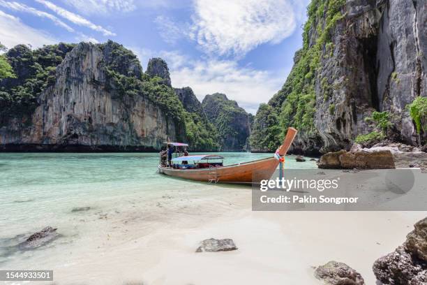 beautiful tropical island bay at phi phi leh island in sunshine day. - maya bay stock pictures, royalty-free photos & images