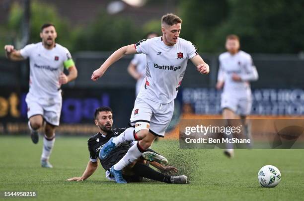 Louth , Ireland - 20 July 2023; John Martin of Dundalk is tackled by Ruben Diaz of FC Bruno's Magpies during the UEFA Europa Conference League First...