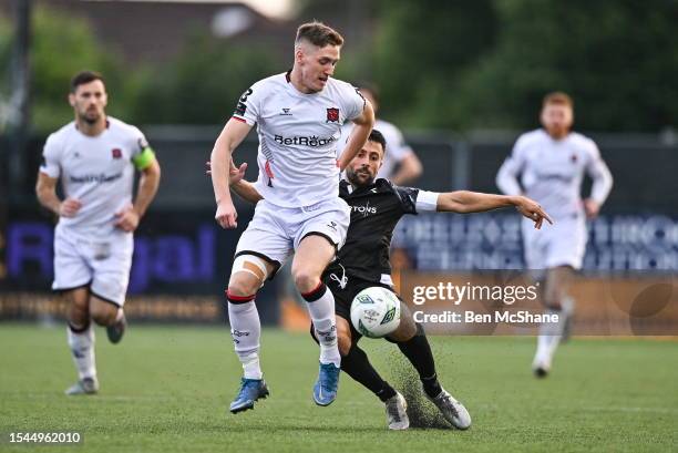 Louth , Ireland - 20 July 2023; John Martin of Dundalk is tackled by Ruben Diaz of FC Bruno's Magpies during the UEFA Europa Conference League First...