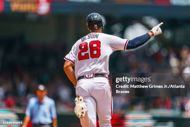 Matt Olson of the Atlanta Braves celebrates after hitting a home run in the eighth inning during the game against the Arizona Diamondbacks at Truist...