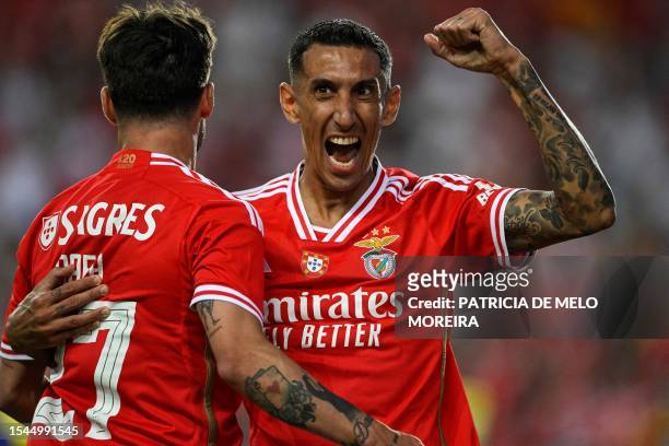Benfica's Argentine forward Angel Di Maria celebrates with his teammate Benfica's Portguese forward Rafa Silva after scoring against Al Nassr during...