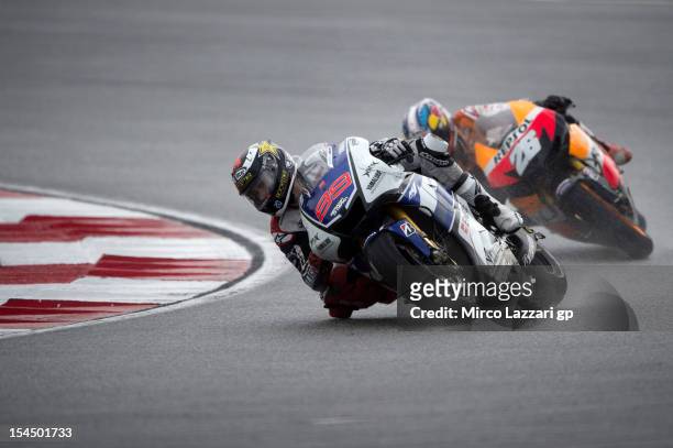 Jorge Lorenzo of Spain and Yamaha Factory Team leads Dani Pedrosa of Spain and Repsol Honda Team during the MotoGP race during the MotoGP Of Malaysia...