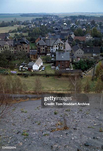 The village of Crossen, East Germany, seen from the top of a uranium waste heap produced by a local mine, 1st March 1991.