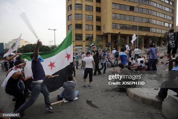 Supportors of the March 14 movement, which opposes the Syrian regime of President Bashar al-Assad, storm the govermental palace in Beirut after the...