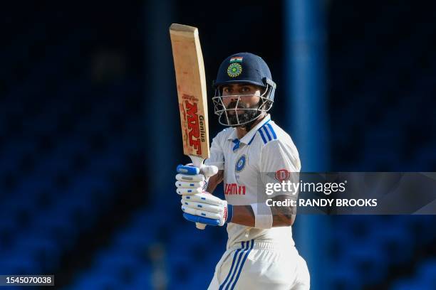 Virat Kohli, of India, hits 4 on the first day of the second Test cricket match between India and West Indies at Queen's Park Oval in Port of Spain,...