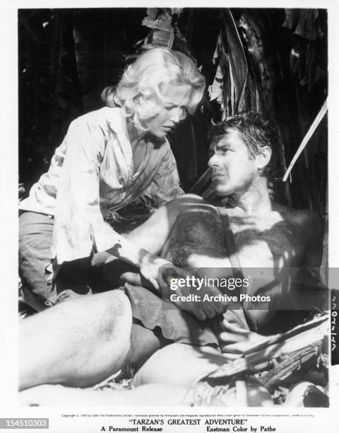 Scilla Gabel takes care of Gordon Scott in a scene from the film 'Tarzan's Greatest Adventure', 1959.