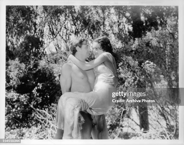 Johnny Weissmuller holds Maureen O'Sullivan in a scene from the film 'Tarzan, The Ape Man', 1932.