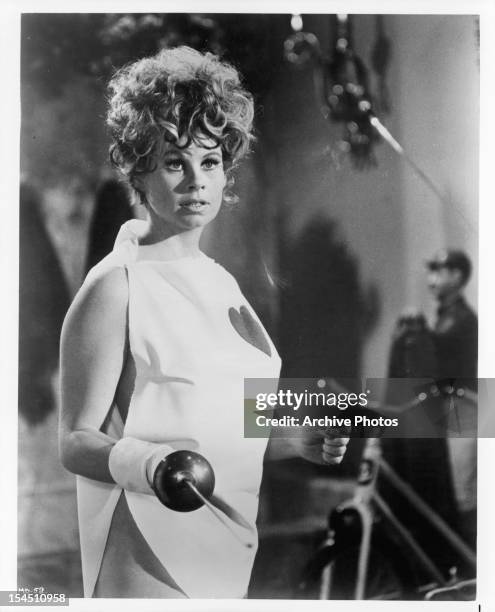 Sue Ane Langdon holds her sword in a scene from the film 'A Man Called Dagger', 1968.