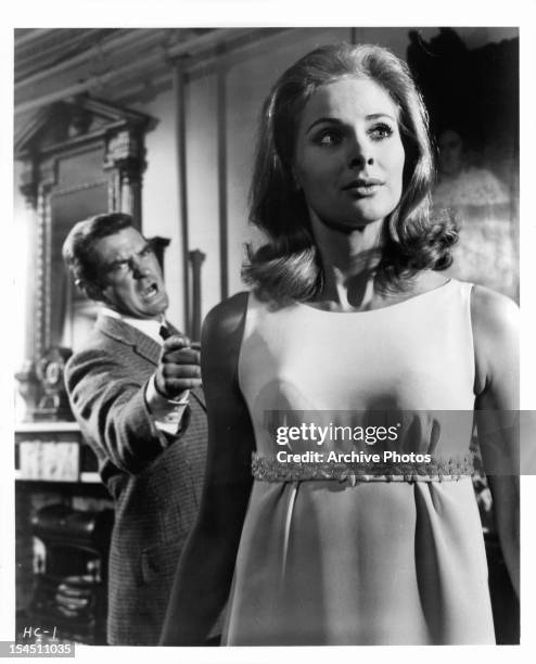 Rod Taylor points and yells at Penelope Horner in a scene from the film 'The Man Who Had Power Over Women', 1970.