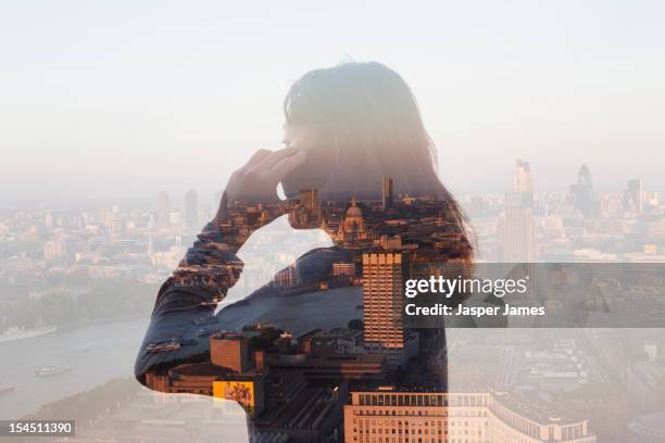 double exposure of woman using phone and cityscape - multiple exposure stock pictures, royalty-free photos & images