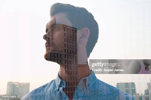 double exposure of man and buildings - multiple exposure stock pictures, royalty-free photos & images