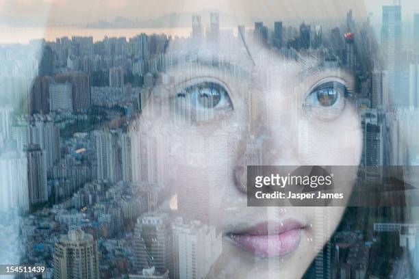 double exposure of woman and cityscape - double exposure face stock-fotos und bilder