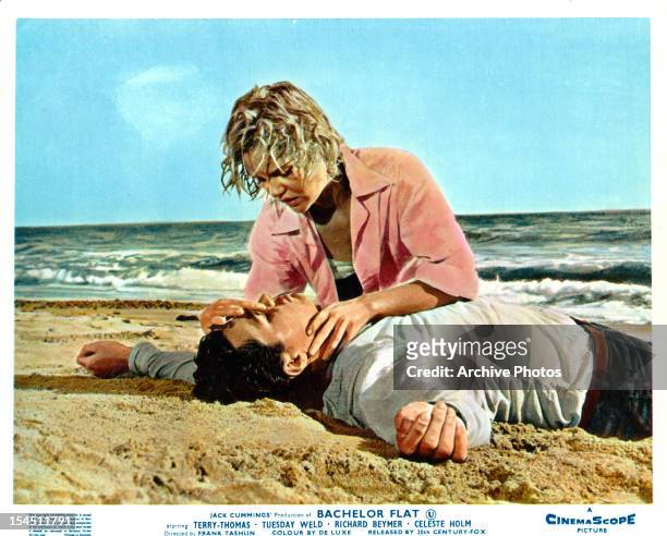 Richard Beymer is given mouth to mouth resuscitation by Tuesday Weld in a scene from the film 'Bachelor Flat', 1962.