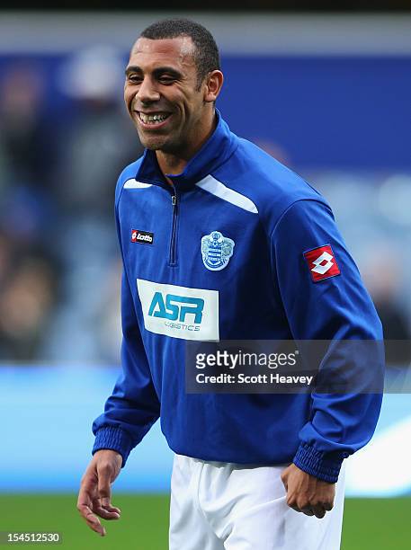 Anton Ferdinand of Queens Park Rangers smiles up as he warms up prior to the Barclays Premier League match between Queens Park Rangers and Everton at...