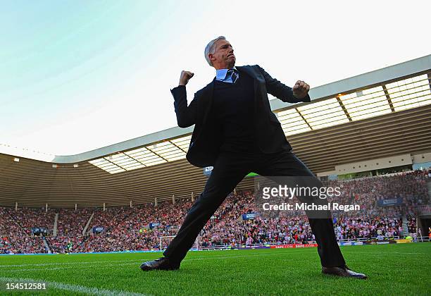 Newcastle manager Alan Pardew celebrates after his team's goal during the Barclays Premier League match between Sunderland and Newcastle United at...