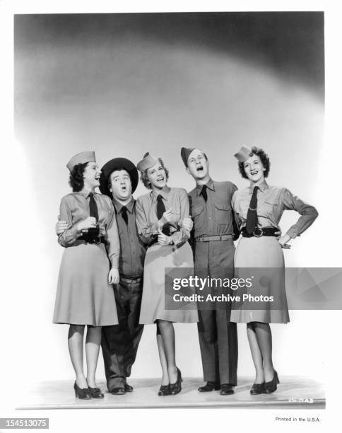 The Andrews Sisters sing with Lou Costello and Bud Abbott in a promotional portrait for the film 'Buck Privates', 1941.