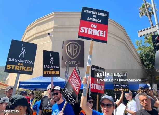 Hollywood writers and their supporters from the SAG AFTRA actors' union go on strike on July 14, 2023 in Los Angeles, California.