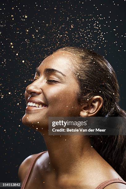 moman covered in shower of sparkles. - body adornment stock pictures, royalty-free photos & images