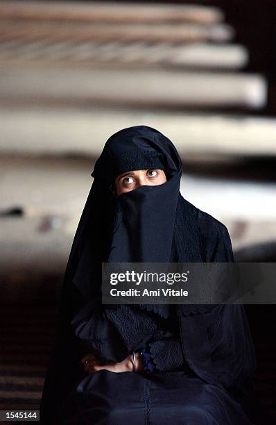 Kashmiri woman prays inside Jama Masjid mosque during afternoon prayers May 24, 2002 in Srinagar, the summer captial of the disputed Indian state of...