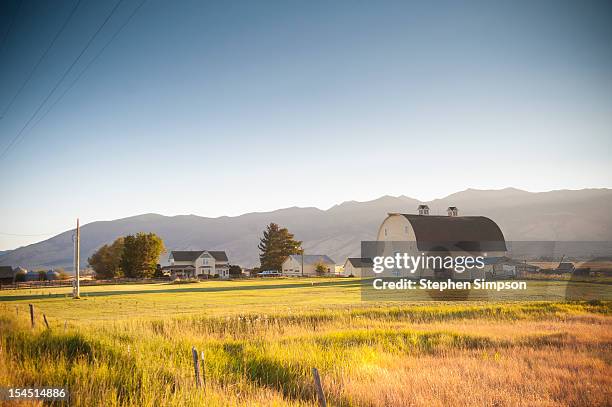 ranch/farm house with barn and out buildings - bozeman stock pictures, royalty-free photos & images