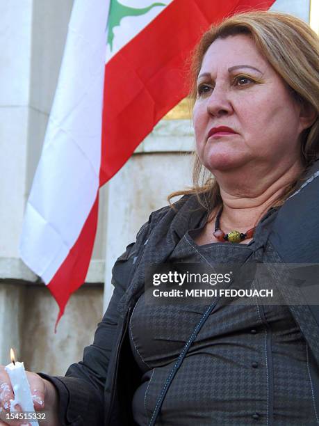 Woman takes part in a rally on October 21, 2012 in Paris, to protest against the killing in a car bombing on October 19 of Lebanon's police...