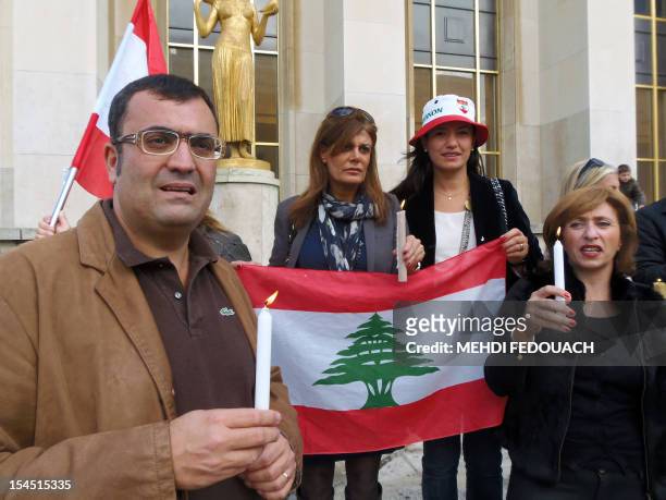People gather during a rally on October 21, 2012 in Paris, to protest against the killing in a car bombing on October 19 of Lebanon's police...