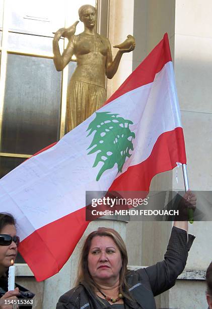 People gather during a rally on October 21, 2012 in Paris, to protest against the killing in a car bombing on October 19 of Lebanon's police...