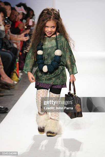 Model walks the runway at Jennie Han show during Petite Parade NY Kids Fashion Week In Collaboration With VOGUEbambini at Industria Superstudio on...