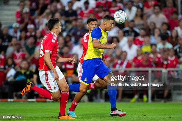 Cristiano Ronaldo of Al Nassr heads the ball during the Pre-Season Friendly match between Al Nassr and SL Benfica at Estadio Algarve on July 20, 2023...