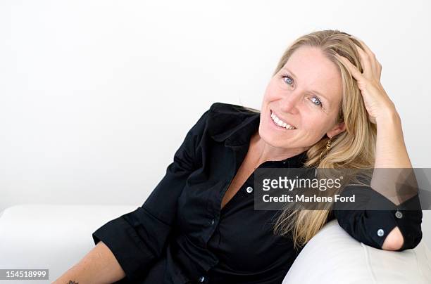 portrait of smiling businesswoman - 40 year old woman blonde blue eyes stock pictures, royalty-free photos & images
