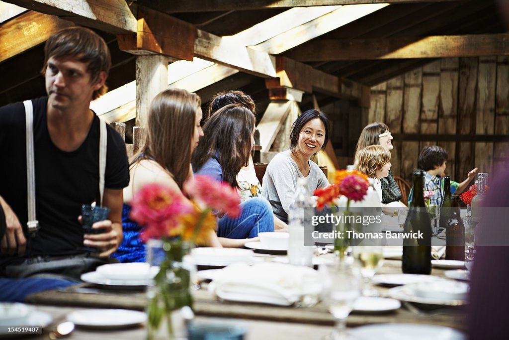 Group of friends and family dining at table