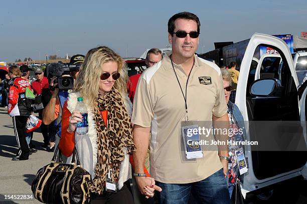 Actor Rob Riggle and his wife Tiffany Riggle attend the NASCAR Sprint Cup Series Hollywood Casino 400 at Kansas Speedway on October 21, 2012 in...