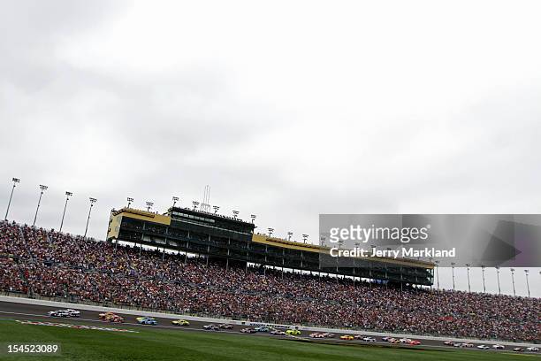 Kasey Kahne, driver of the Farmers Insurance Chevrolet, and Mark Martin, driver of the Aaron's Dream Machine Toyota, lead the field to start of the...