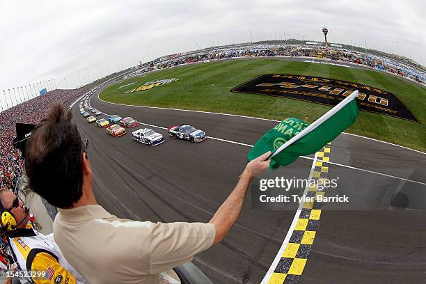 Kasey Kahne, driver of the Farmers Insurance Chevrolet, and Mark Martin, driver of the Aaron's Dream Machine Toyota, lead the field to the green flag...