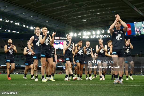 Jacob Weitering of the Blues leads the team off the field after wining the round 18 AFL match between Carlton Blues and Port Adelaide Power at Marvel...