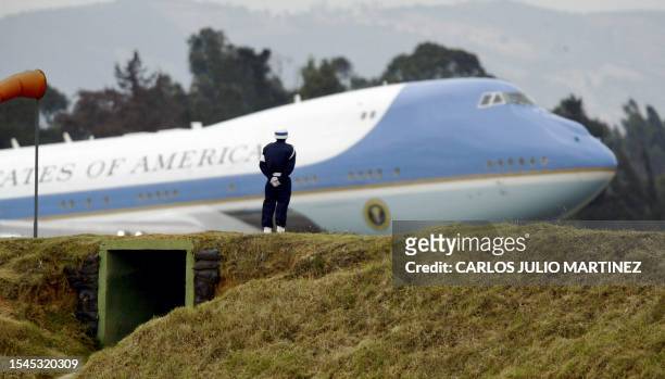 Colombian soldier looks at US President George W. Bush's plane Air Force One 11 March, 2007 upon its arrival at Catam Military Airport in Bogota,...